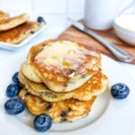 Stack of pancakes with blueberries.