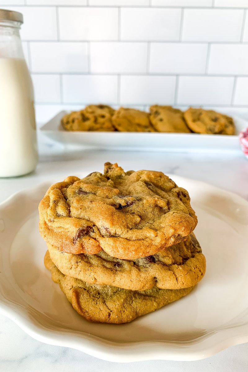 Stacked cookies on a white plate.