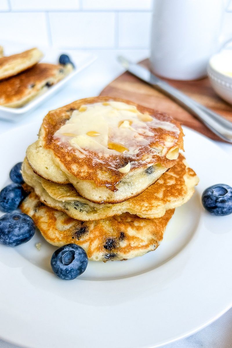 Stack of pancakes with blueberries.