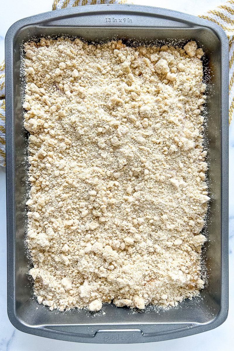 A pan of unbaked peach cobbler.
