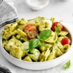 A bowl of pesto with tortellini.