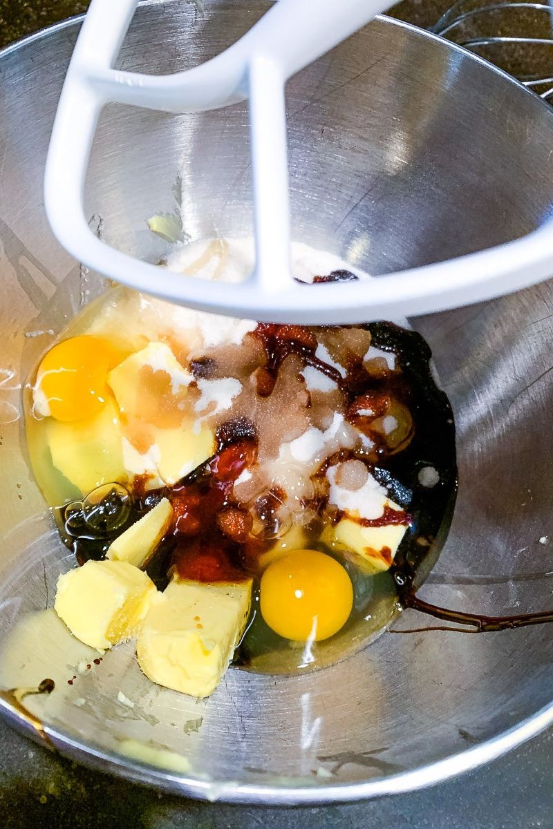 Raw ingredients on a mixing bowl for cookie recipe.