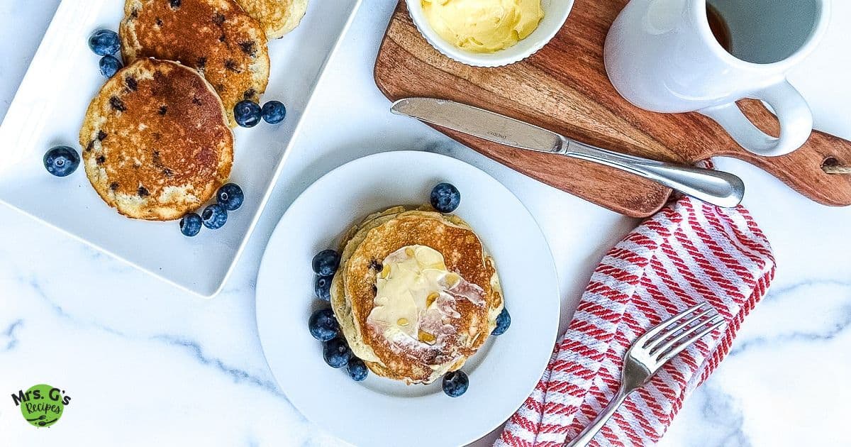 A plate and a platter of muffin mix pancakes.