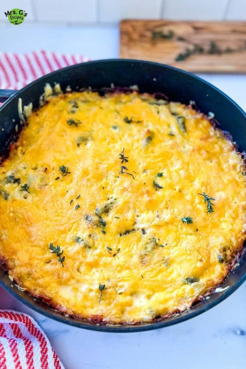 A skillet pan of chicken and hash brown casserole.