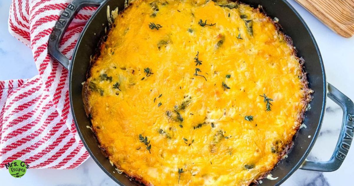 A skillet pan of chicken and hash brown casserole.