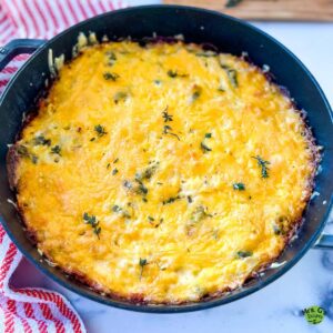 A skillet pan of chicken and hash brown casserole.