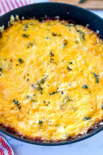 A skillet pan of chicken and hash brown casserole.