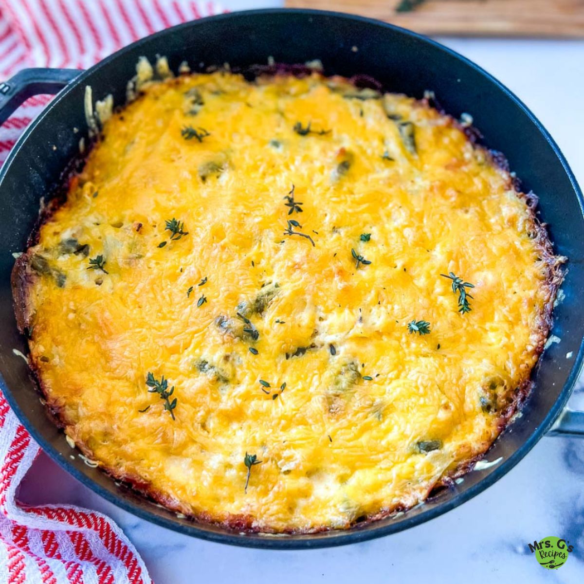A skillet pan of chicken and hash brown casserole.