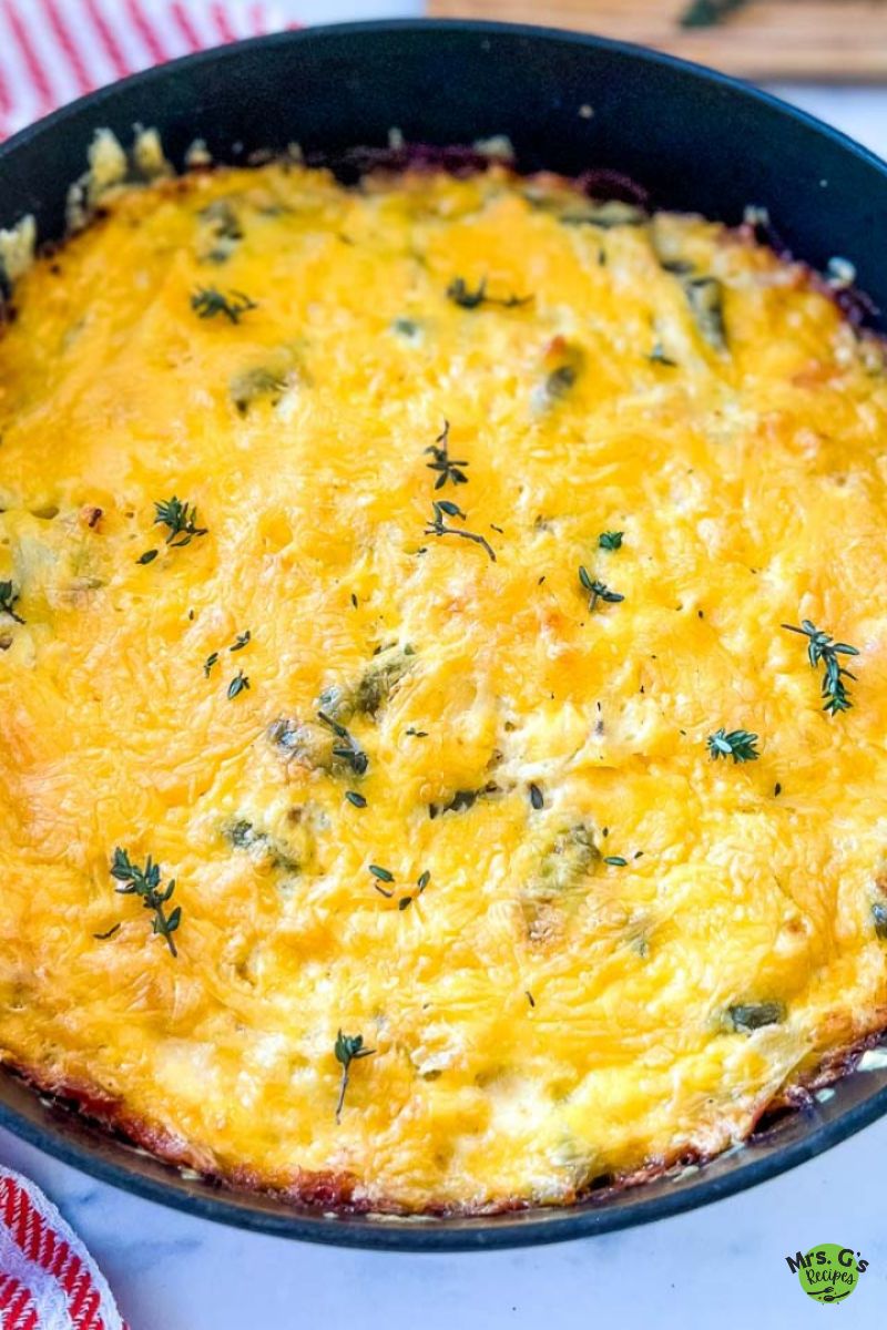 A skillet pan of chicken and hash brown casserole.