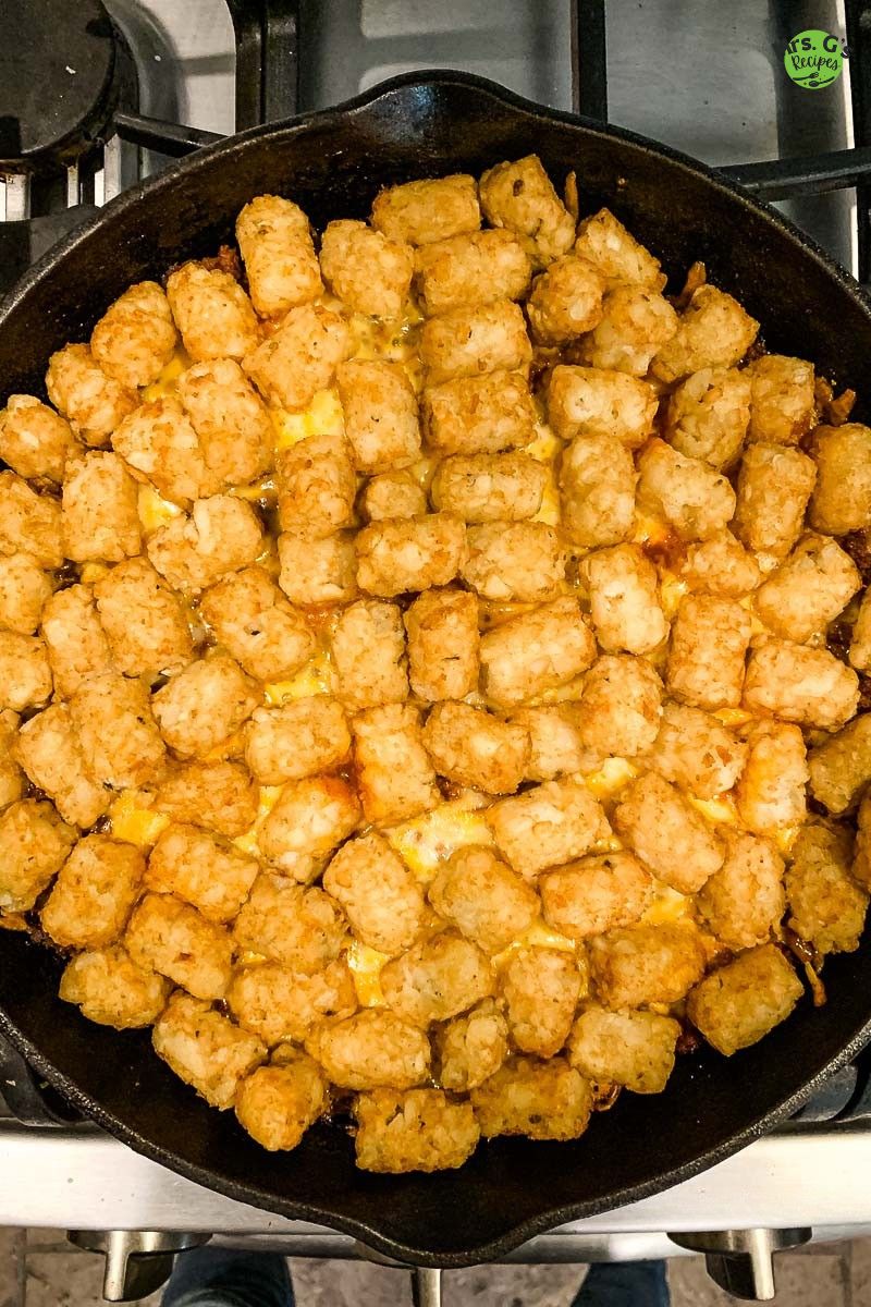 A skillet of tater tots.