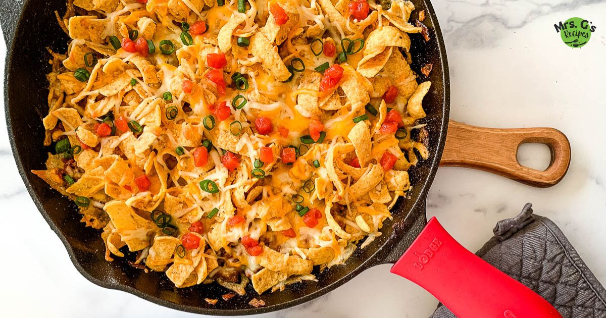 A skillet of frito pie casserole.