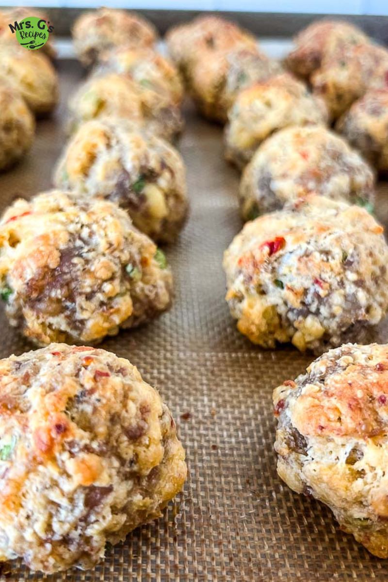 Sausage balls on a baking sheet.