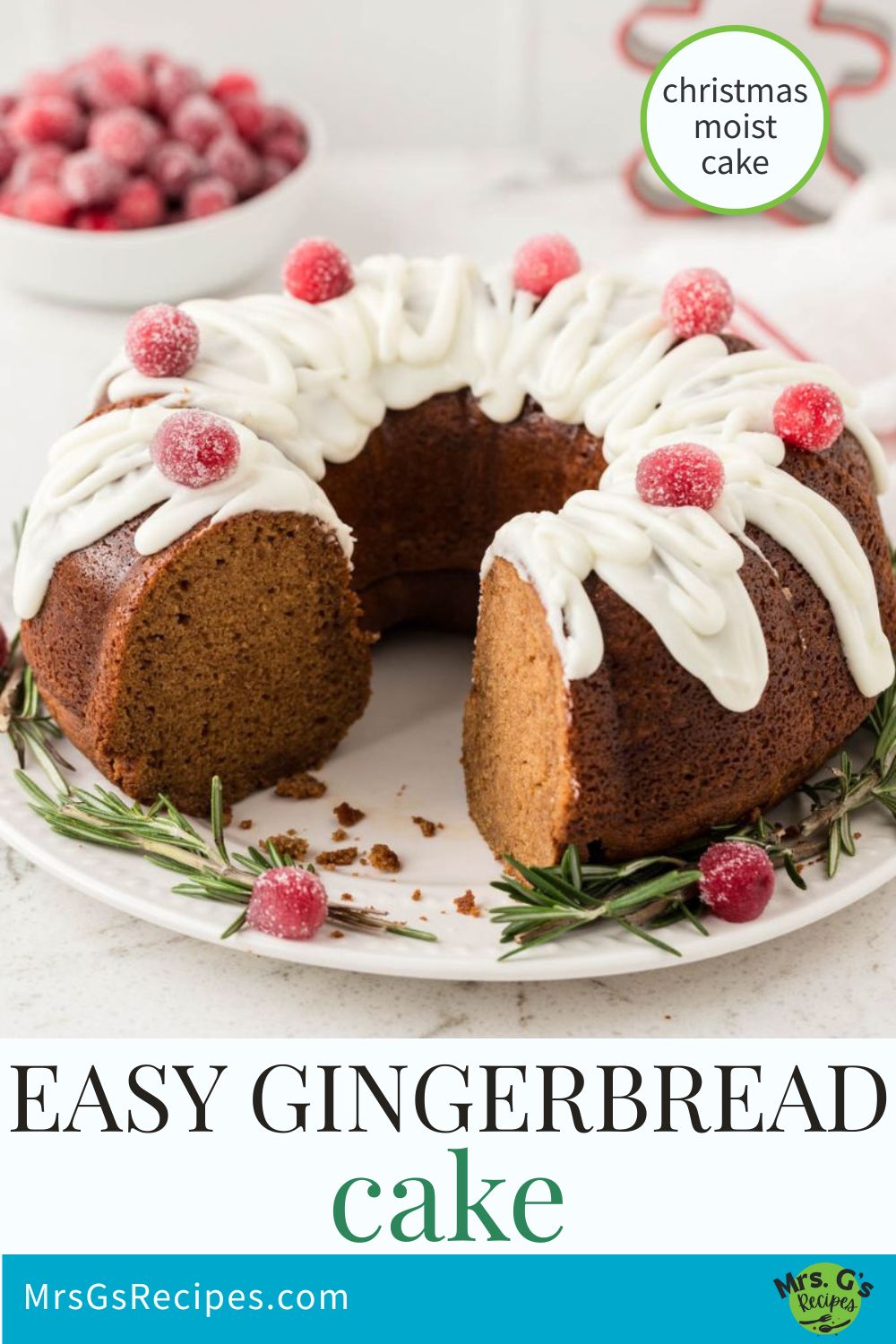 A vertical image with the title "EASY GINGERBREAD cake" at the bottom. The image is of a sliced gingerbread Bundt cake decorated with white icing and sugared cranberries, sitting on a white plate with a garnish of rosemary. The website "MrsGsRecipes.com" is at the bottom.