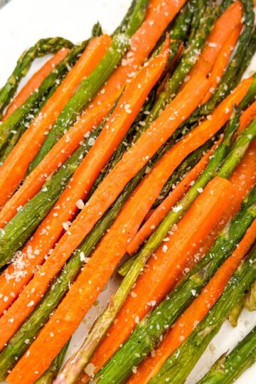 a plate of roasted carrots and asparagus.
