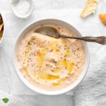 a bowl of feta dip with cream cheese.