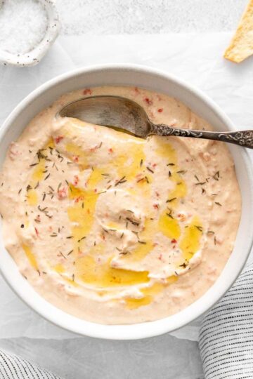 a bowl of feta dip with cream cheese.