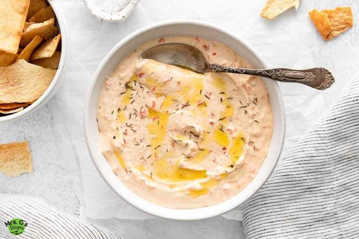 a bowl of roasted red pepper feta dip.
