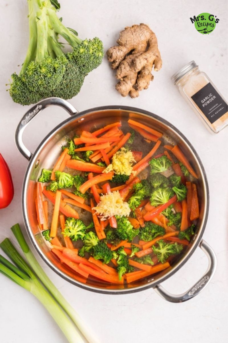 Stir-fried vegetables in a pan.