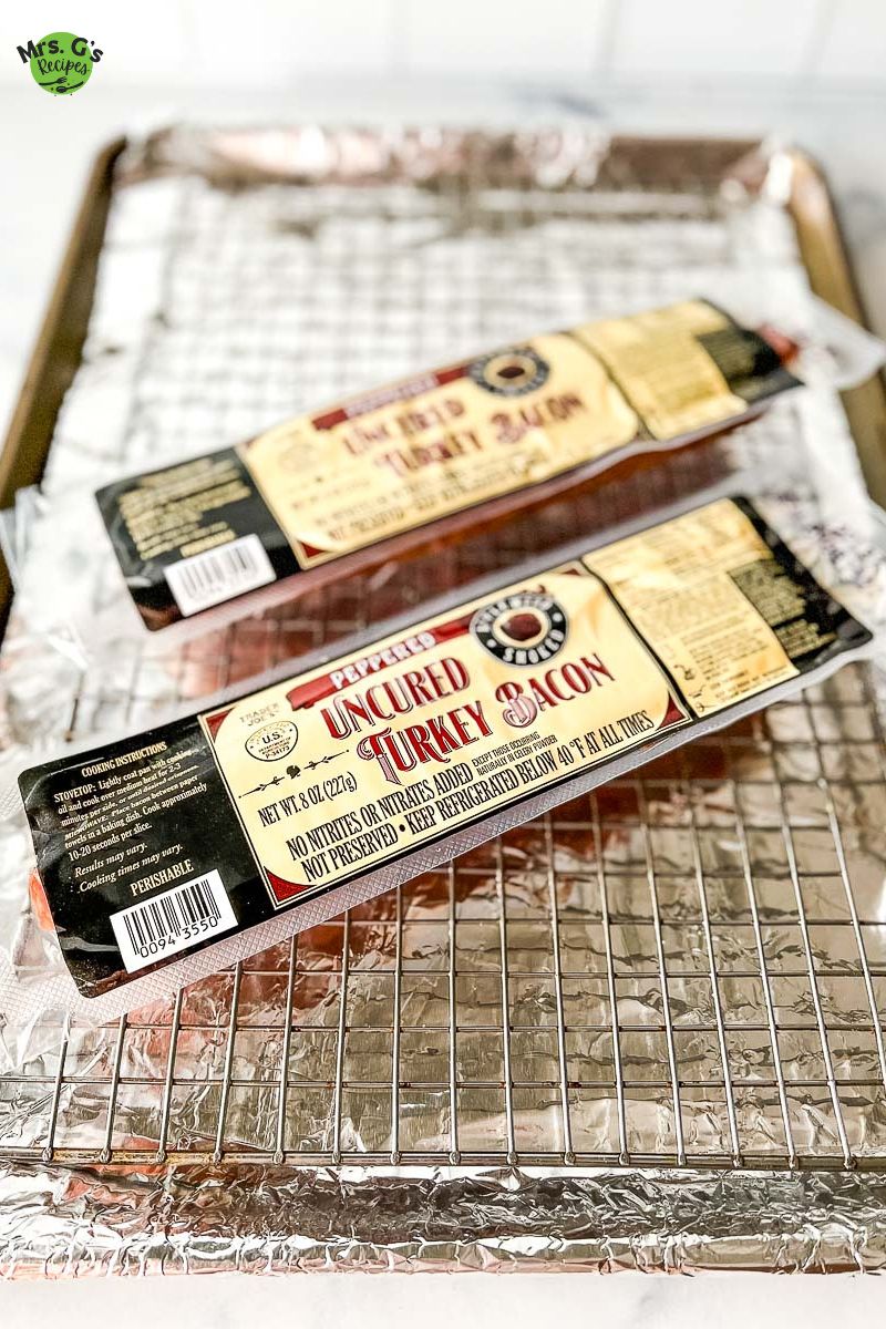 two pack of turkey bacon strips on a baking rack.