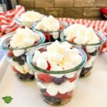 Red white and blue salad in small glass cups.